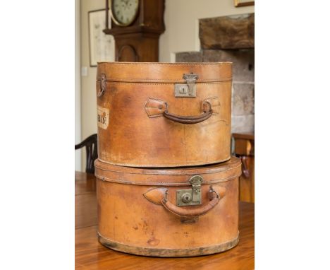 A Chinese brown leather hat box, by the Nan Hing Leather Co. Shanghai, 18 x 16¾ x 9¾in. (45.75 x 42.5 x 24.75cm.); together w