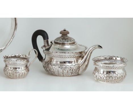 A Victorian three piece bachelor's tea service, Josiah Williams & Co., London 1893, of circular form with band of repoussé ac