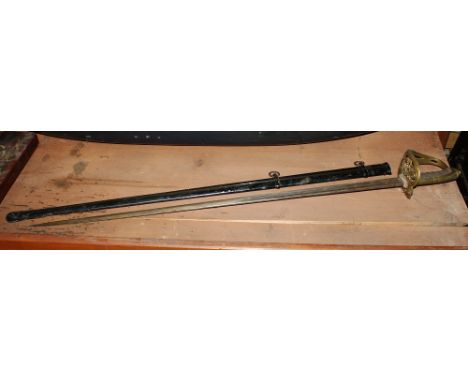 A Victorian British Army Officer's sword, the 32½in. single edged, double fullered blade with etched decoration and inset bra