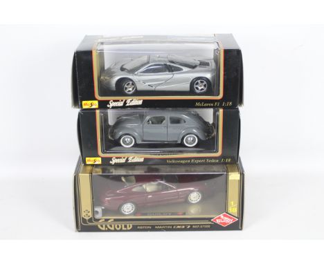 Maisto, Guiloy - Three boxed 1:18 scale diecast model cars. Lot includes Guiloy #67550 Aston Martin DB7; Maisto 'Special Edit