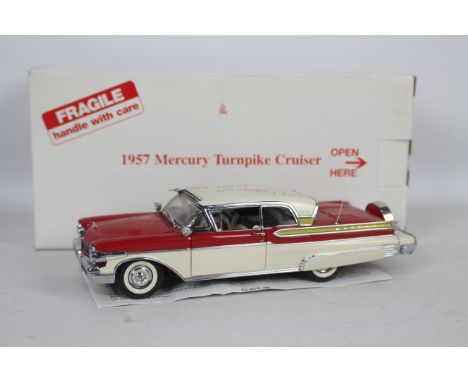 Danbury Mint - A boxed Danbury Mint diecast 1:24 scale 1957 Mercury Turnpike Cruiser . The model in red and white appears to 