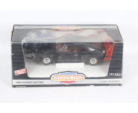 Ertl - A boxed Ertl 'American Muscle' 1:18 scale 1969 Dodge Charger Daytona. The model in black appears to be in Excellent ov