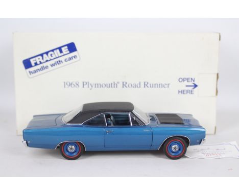 Danbury Mint - A boxed Danbury Mint diecast 1:24 scale 1968 Plymouth Road Runner. The model in blue and black appears to be i