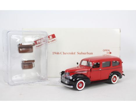 Danbury Mint - A boxed Danbury Mint diecast 1:24 scale 1946 Chevrolet Suburban. The model in red and black appears to be in N