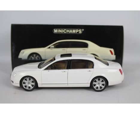 Minichamps - A boxed 1:18 scale Bentley Continental Flying Spur 2005. The model in white appears to be in Good overall condit