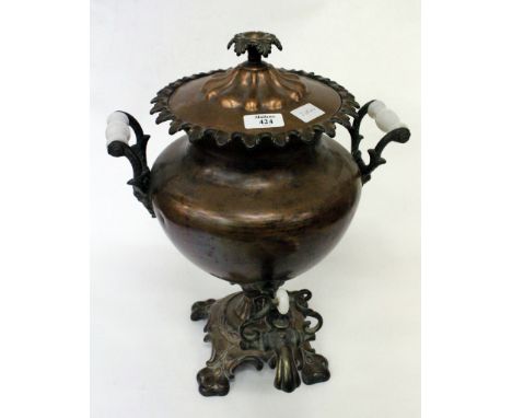 AN ART NOUVEAU COPPER SAMOVAR with glass handles and shaped edge and loose scroll finial
