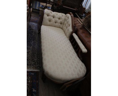 A VICTORIAN MAHOGANY CHAISE LONGUE with button upholstered scroll end and standing on turned tapering legs, 180cm wide 