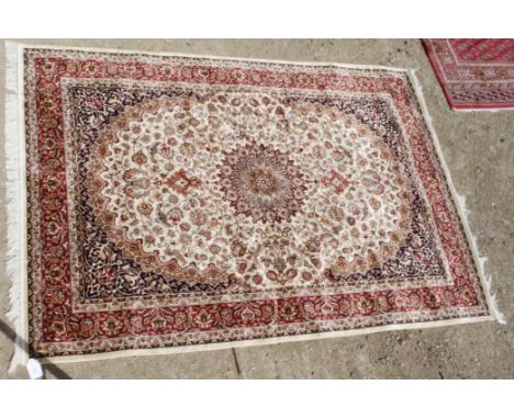 A MACHINE MADE BEIGE GROUND KESHAN CARPET, 230cm x 160cm