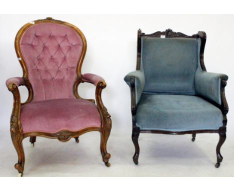 A VICTORIAN LADIES CHAIR with a carved top rail and button back pink velour upholstery on casters and a reproduction blue vel