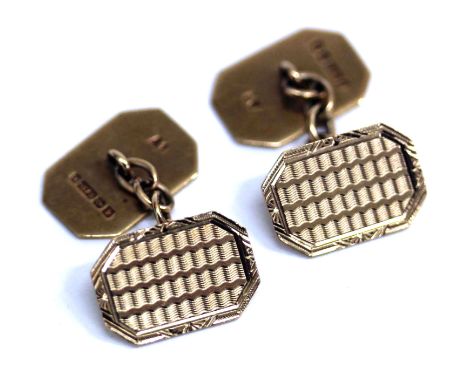 A PAIR OF 9 CARAT GOLD CUFFLINKS of rectangular form with canted corners and engraved decoration, with marks for Birmingham 1