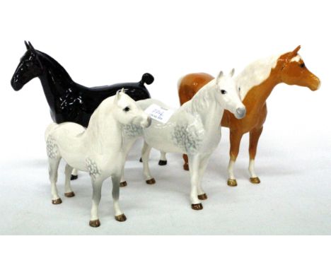 FOUR BESWICK HORSES including a Welsh mare, a Connemara, a Palomino pony and a model titled 'Black Magic'