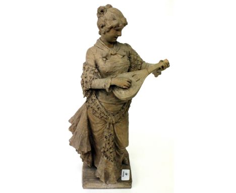 A TERRACOTTA STATUE OF A LADY PLAYING THE LUTE, 47cm high, with damages