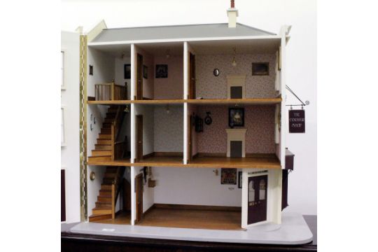 A HANDMADE ORIGINAL DESIGN, TREVOR AND SUE COOK DOLLS HOUSE SHOP, c ...