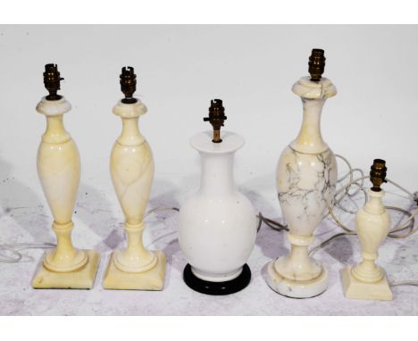 A COLLECTION OF FOUR MARBLE AND ONE CERAMIC TABLE LAMPS of baluster column form including one pair, 41cm high (5)