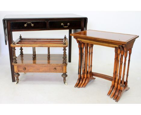 A VICTORIAN AND LATER WALNUT CANTERBURY with turned supports, single frieze drawer and turned tapering legs terminating in ce