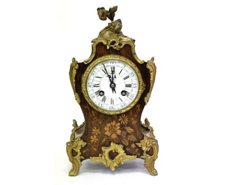 A FRENCH ROSEWOOD CASED MANTLE CLOCK with cast gilt metal mounts and floral inlay with enamel dial, the movement striking the