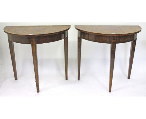 A PAIR OF WALNUT D SHAPED SIDE OR CONSOLE TABLES each with three square tapering legs, 83.5cm wide (2)