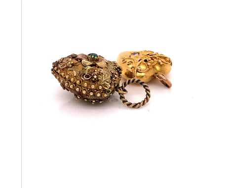TWO ANTIQUE GOLD HEART PENDANTS. ONE A LOCKET WITH A HINGED UP AND OVER OPENING CONTAINING A LOCK OF HAIR BEHIND A GLAZED PAN