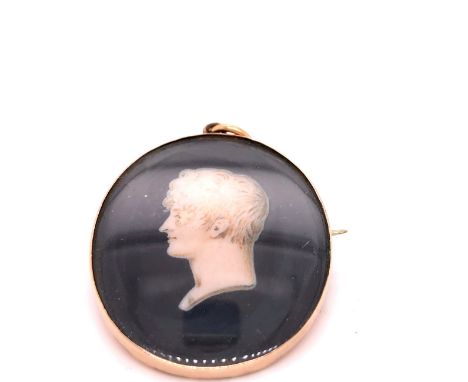 A GEORGIAN GOLD MOUNTED PAINTED PORTRAIT MINIATURE OF A BUST PROFILE, SIGNED INDISTINCTLY, POSSIBLY H.J.GARVEY, DATED 1807?. 