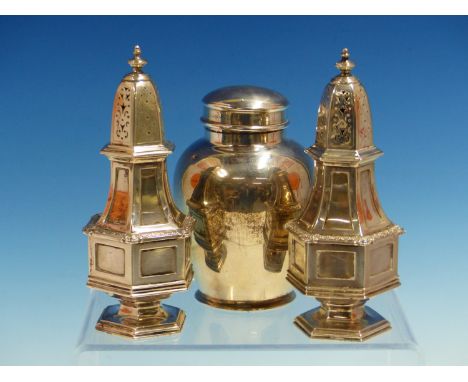 A PAIR OF HALLMARKED SILVER TABLE PEPPERS FOR GARRARD AND CO LTD TOGETHER WITH A SILVER HALLMARKED TEA CADDY. GROSS WEIGHT 43