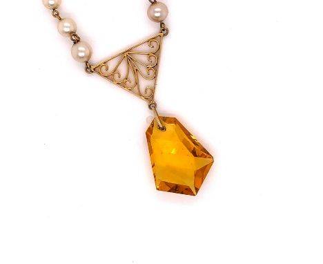 A 9ct GOLD CITRINE AND GRADUATED PEARL DROP PENDANT. WITH AN OPEN WORK PANEL. LENGTH 41cms, WEIGHT 6.3grms. 