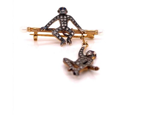 AN ANTIQUE BAR BROOCH WITH SEATED DIAMOND AND SAPPHIRE SET CHIMPANZEE AND A FURTHER RUBY AND DIAMOND SET CHIMPANZEE SUSPENDED