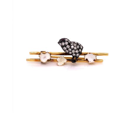 A VICTORIAN DIAMOND AND ENAMEL HATCHING CHICK BROOCH. THE CHICK SET WITH OLD CUT DIAMONDS AND A RUBY EYE, WITH WHITE ENAMEL S