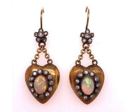 VICTORIAN OPAL AND DIAMOND PUFFED HEART ARTICULATED DROP EARRINGS ON GOLD WIRES. THE CENTRAL OPALS FRAMED WITH A BORDER OF DI