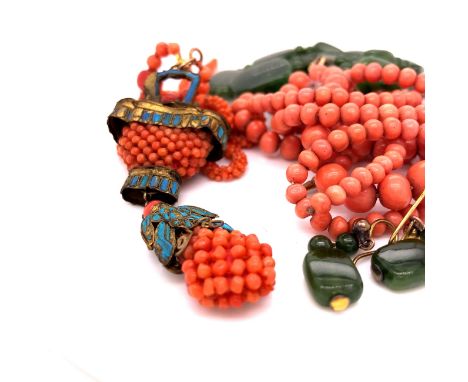 AN EASTERN PENDANT CONSISTING OF WOVEN CORAL BEADS WITH GILDED AND ENAMEL FITTINGS AND AN ARTICULATED DROPPER TOGETHER WITH A