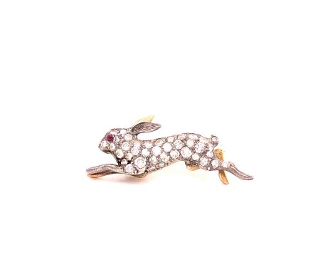 A VICTORIAN RUNNING HARE OLD CUT DIAMOND SET BROOCH. THE PAVE SET BODY COMPLETED WITH A RUBY SET EYE. MEASUREMENTS 3cms X 1cm