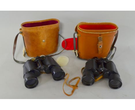 Two pairs of binoculars, a letter rack with fitted doors, and other items to include elephants, wooden birds, a carriage cloc