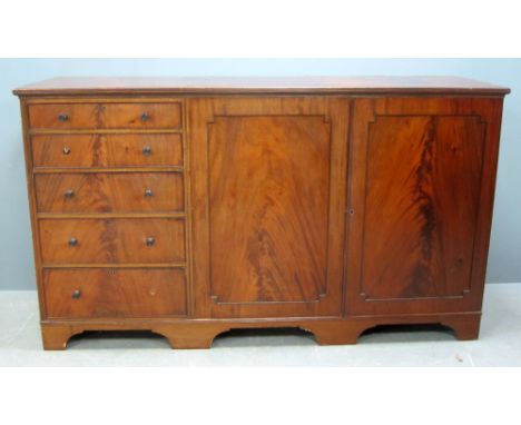 19th century mahogany dresser with two cupboard doors flanked by five drawers, fitted interior with trays, on bracket feet 10