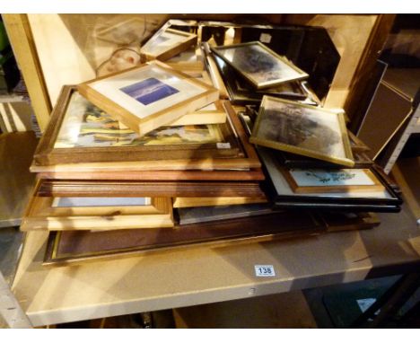 Shelf of pictures and mirrors