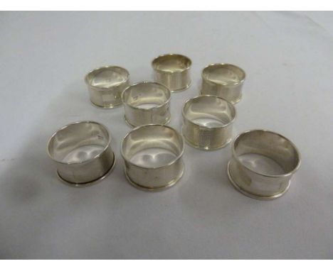 A set of eight engine turned silver napkin rings