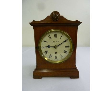 L. & N.W. RY no. 4403 railway mantle clock of architectural form circular dial with Roman numerals on four bracket feet to in