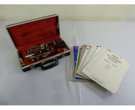 Boosey and Hawkes clarinet in fitted case and accompanying sheet music