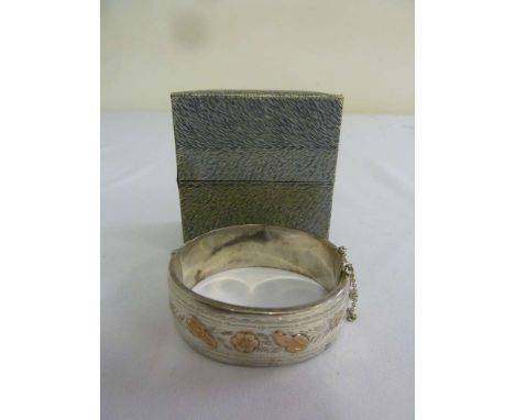 Silver and gold bangle in original fitted case