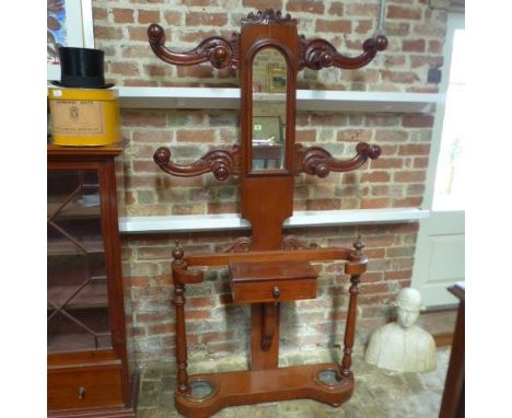 A Victorian mahogany mirror back tree hallstand with glove drawer and stick stands - Height 202cm x Width 111cm x Depth 26cm 