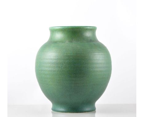 Edward Thomas Radford for Pilkington's Royal Lancastrian, a ribbed vase, circa 1920, swollen form in matt green glaze, incise