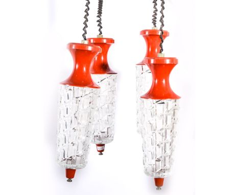 European, an enamelled and moulded glass ceiling light, circa 1970, the red enamelled rose supporting four similar enamel fit