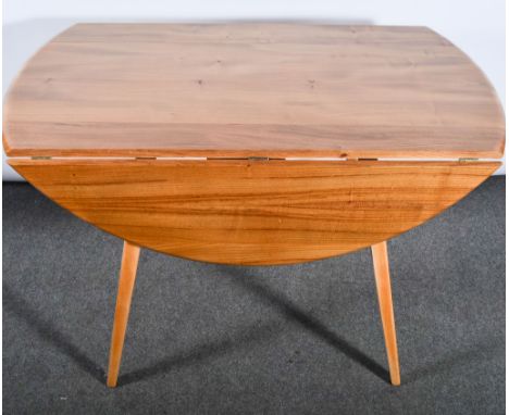 Lucian Ercolani for Ercol, an elm and beech rounded shaped dining table, shape 384, drop end leaves, 113cm dial, height 72cm.