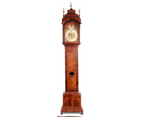 NICHOLAS LAMBERT, LONDON. AN EARLY 18th CENTURY BURR WALNUT QUARTER CHIMING LONGCASE CLOCK having a caddy top above break arc