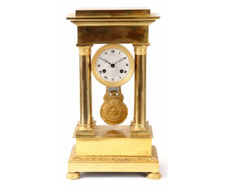 A MID 19th CENTURY FRENCH ORMOLU PORTICO MANTEL CLOCK the gilt brass case with four tapered columns, stepped pediment and pli