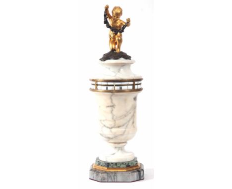 A LATE 19th CENTURY FRENCH MARBLE ANNULAR DIAL MANTEL CLOCK the urn shaped case with removable top surmounted by a gilt bronz