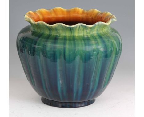 A LARGE EARLY 20th CENTURY LINTHORPE POTTERY JARDINIÈRE with green and orange glaze, ribbed body and scalloped rim, impressio