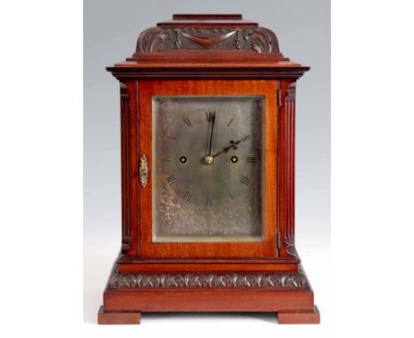 A SMALL LATE 19th CENTURY MAHOGANY DOUBLE FUSEE BRACKET CLOCK the carved case with caddy top above glazed door and canted ree