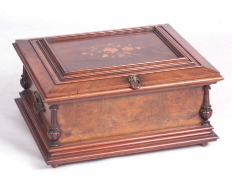 A LATE 19th CENTURY WALNUT INLAID SYMPHONIUM MUSIC BOX the moulded hinged lid with floral inlaid panel on box base with turne