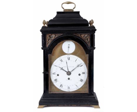 JOHN TAYLOR, LONDON. A GEORGE III EBONISED QUARTER CHIMING ENAMEL DIAL BRACKET CLOCK the inverted bell top case with pierced 