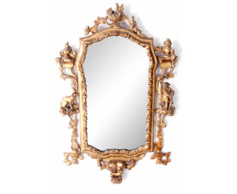 AN EARLY 18TH CENTURY CARVED WOOD AND GILT GESSO HANGING MIRROR decorated with floral rococo decoration having a Huntsman and
