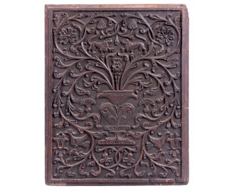 A 17TH CENTURY CARVED WALNUT PANEL with lions and birds amongst floral work and thistle decoration 65cm high 51cm wide.
